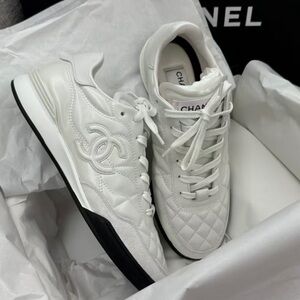 CHANEL White Quilted Sneakers with Black Sole
